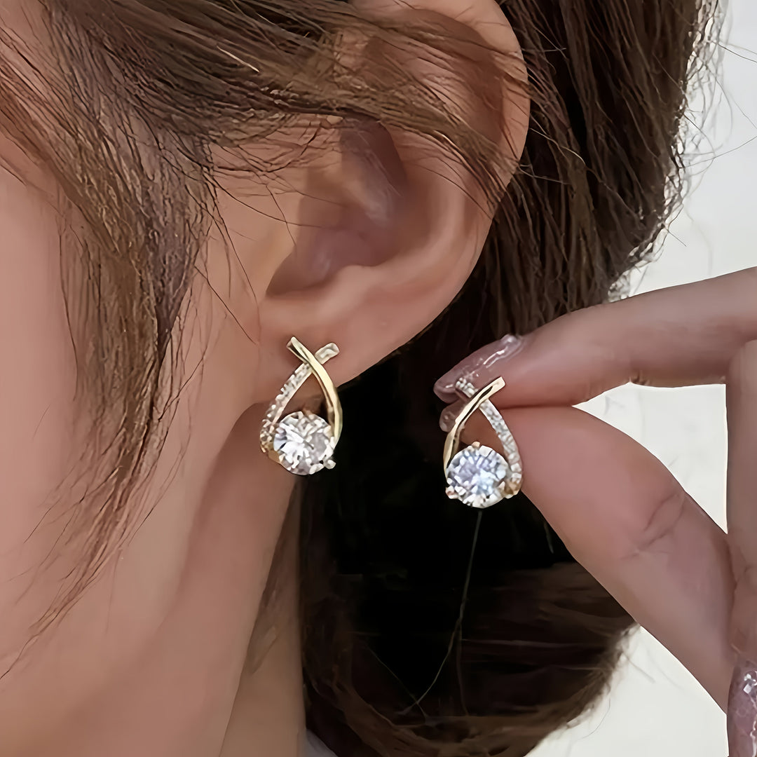 Boucles d'oreilles en or avec croix et zircon