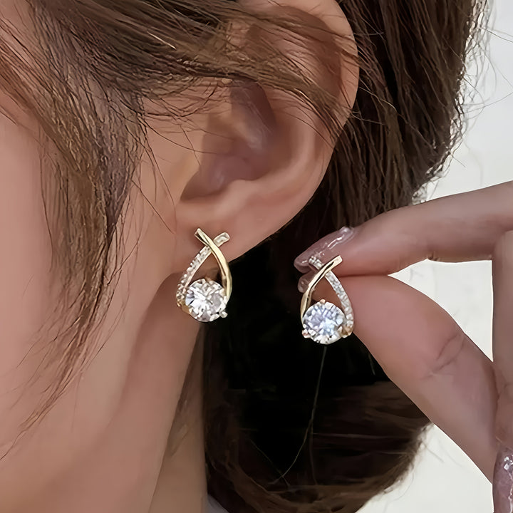 Boucles d'oreilles en or avec croix et zircon