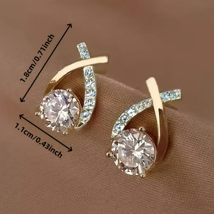Boucles d'oreilles en or avec croix et zircon