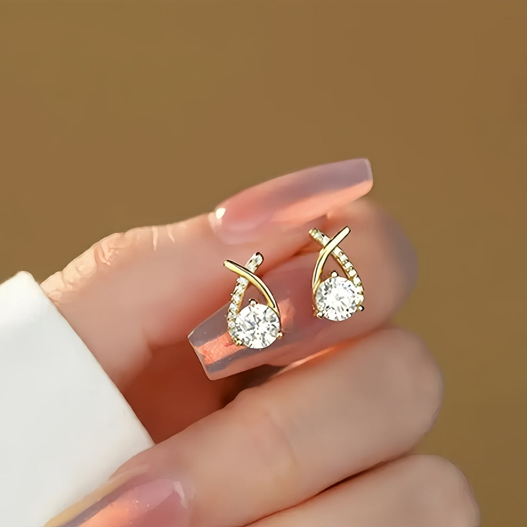 Boucles d'oreilles en or avec croix et zircon