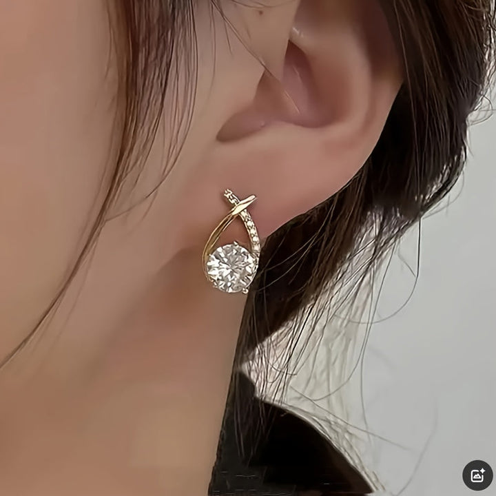 Boucles d'oreilles en or avec croix et zircon