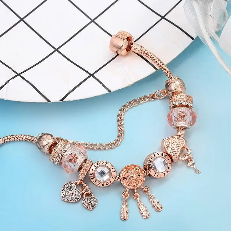 Bracelet Attrape-Rêves Rose avec Charms en Argent Sterling Inclus" can be rewritten as:

"Bracelet Rose Attrape-Rêves avec Charms en Argent Sterling