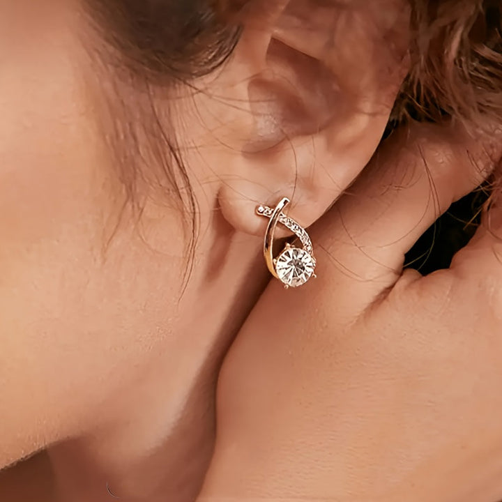 Boucles d'oreilles en or avec croix et zircon