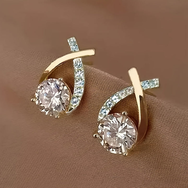 Boucles d'oreilles en or avec croix et zircon