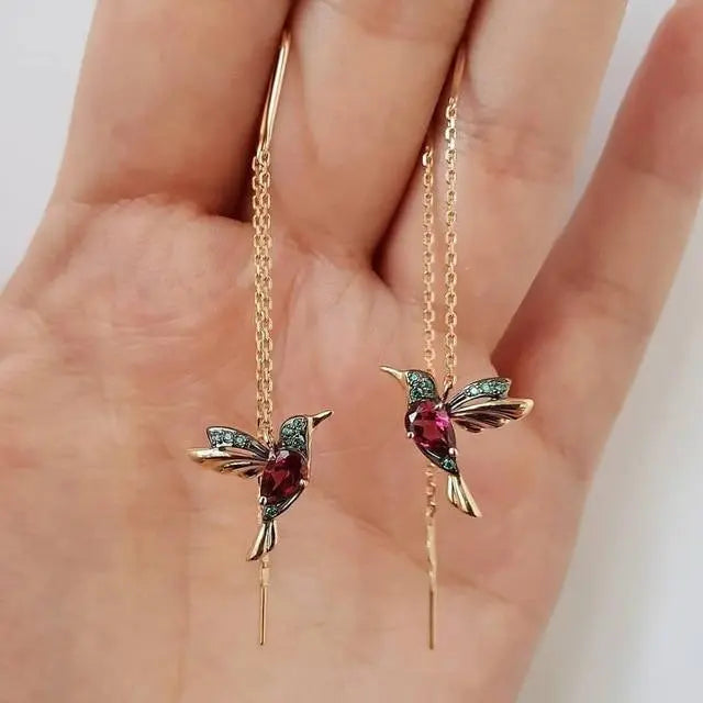 Boucles d'oreilles en or ornées d'un colibri et de cristaux